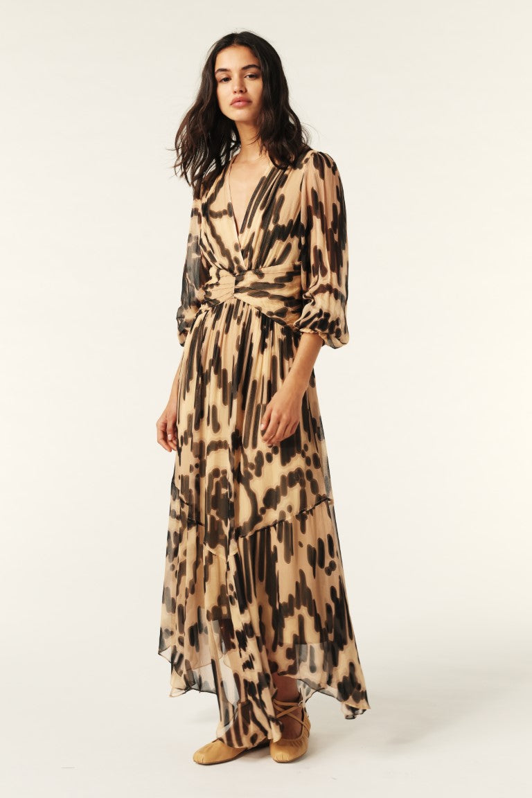 Woman wearing a patterned dress on a white background