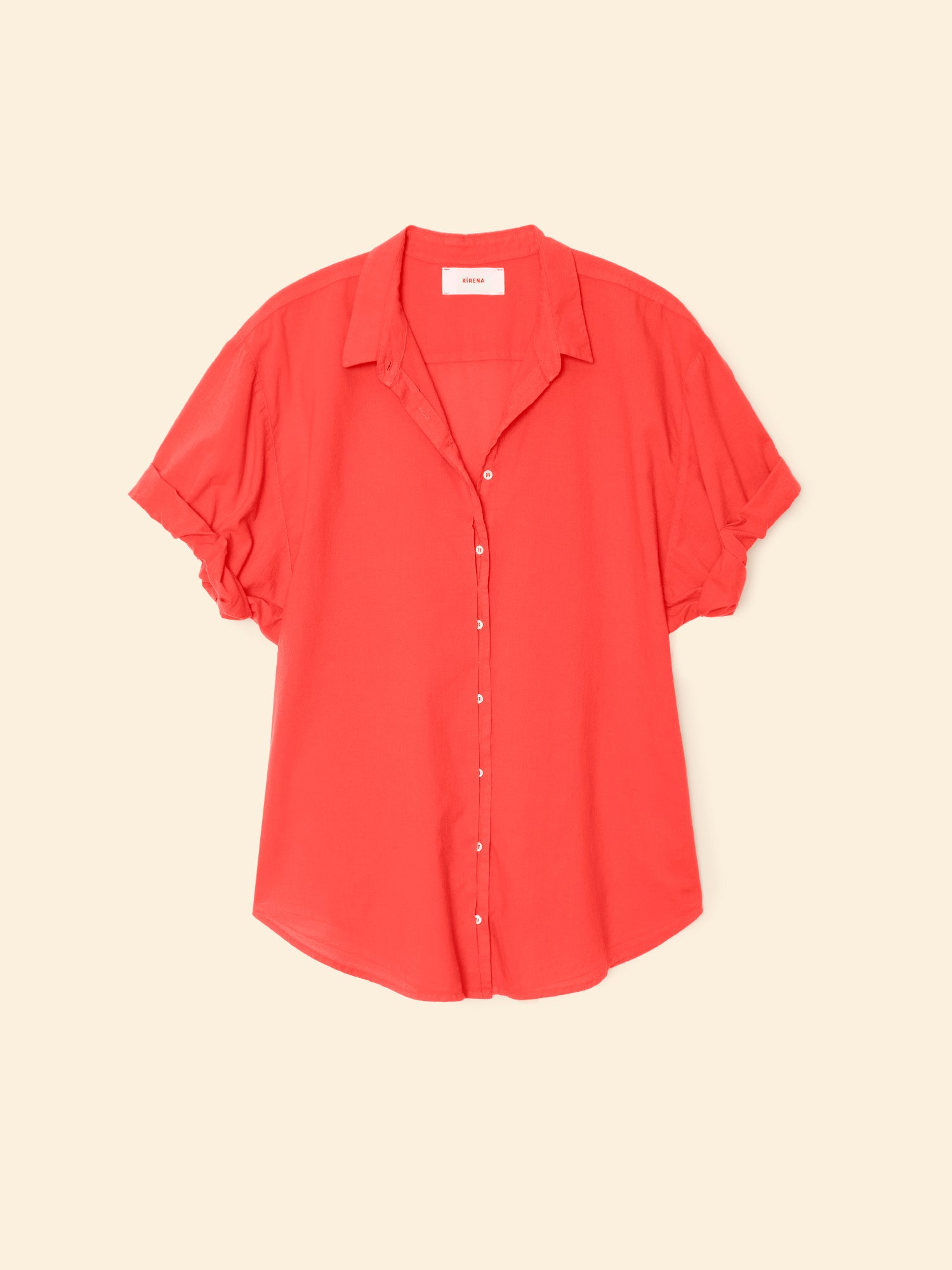 Red blouse on a beige background
