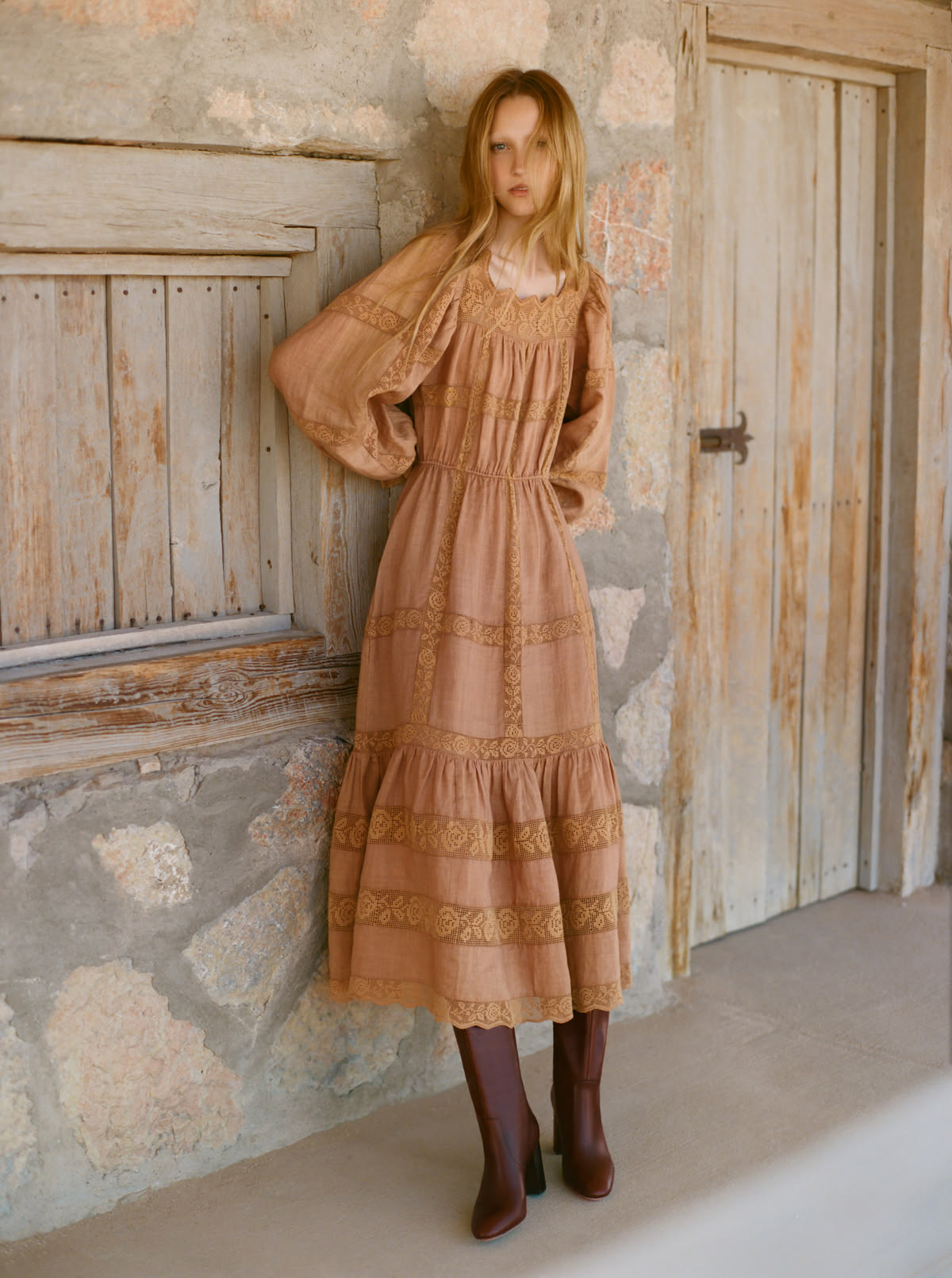 Tiered lace-trimmed midi dress with balloon sleeves, worn with brown leather boots