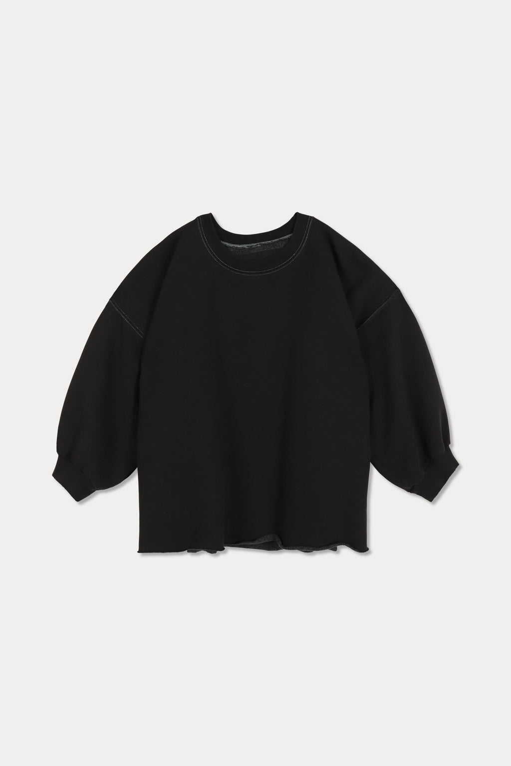 Black sweater on a light gray background