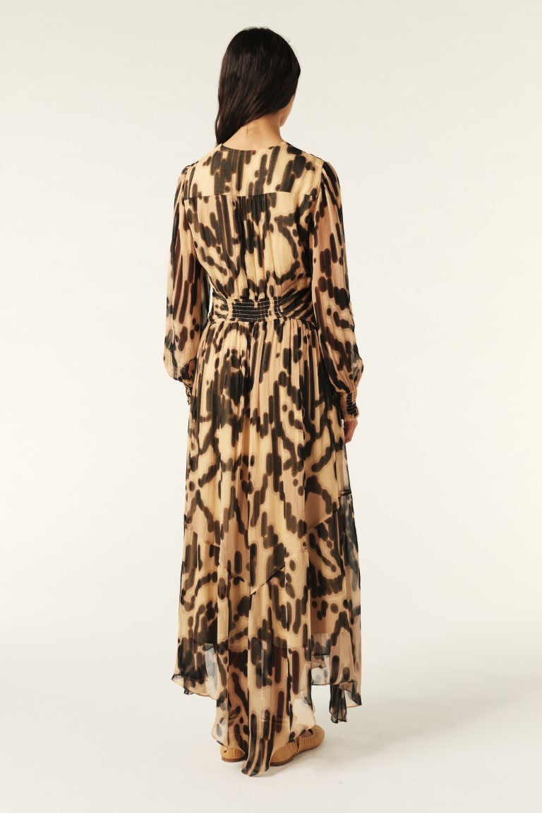 Woman wearing a leopard print dress on a white background
