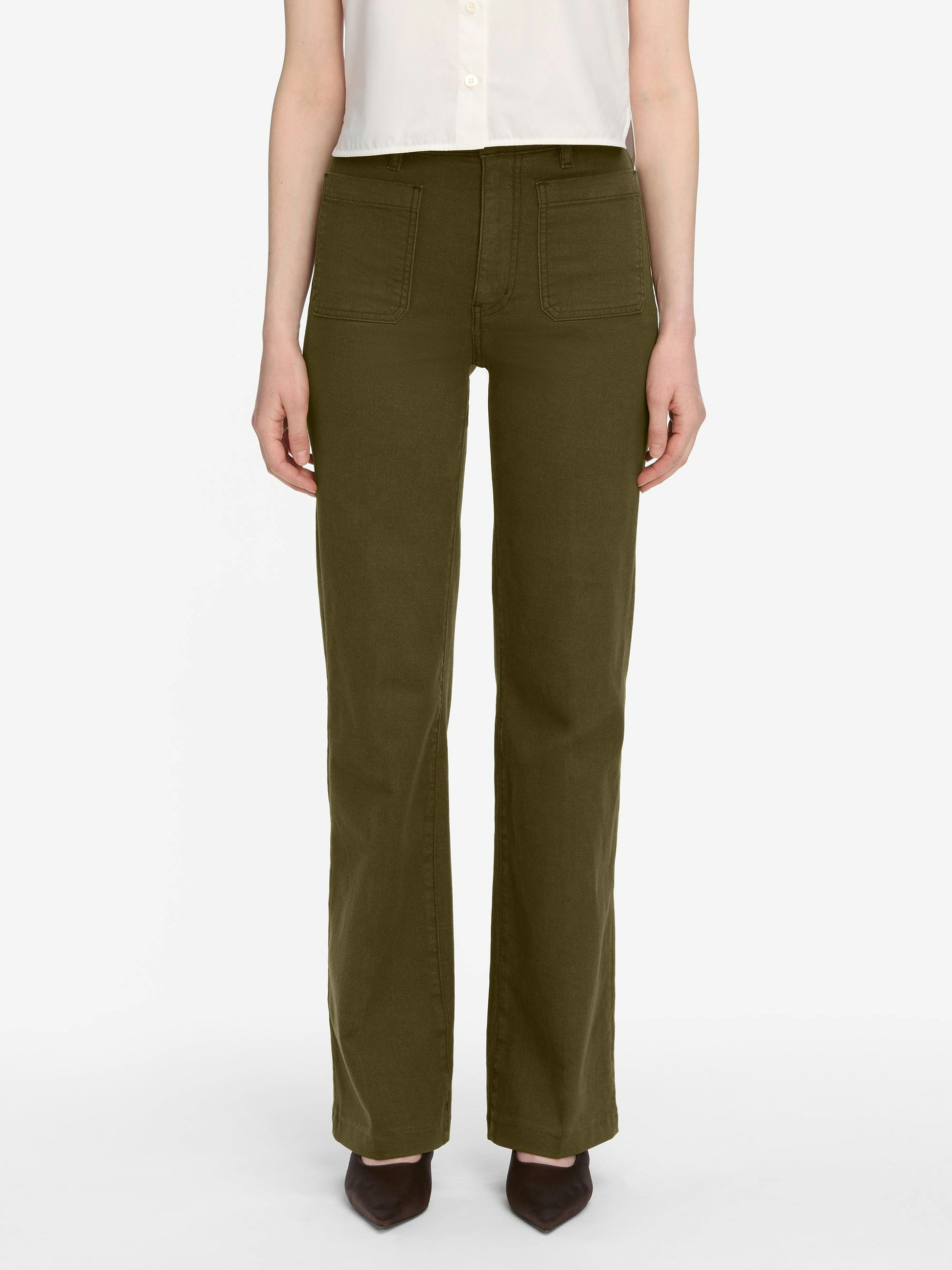 Person wearing olive green pants on a white background