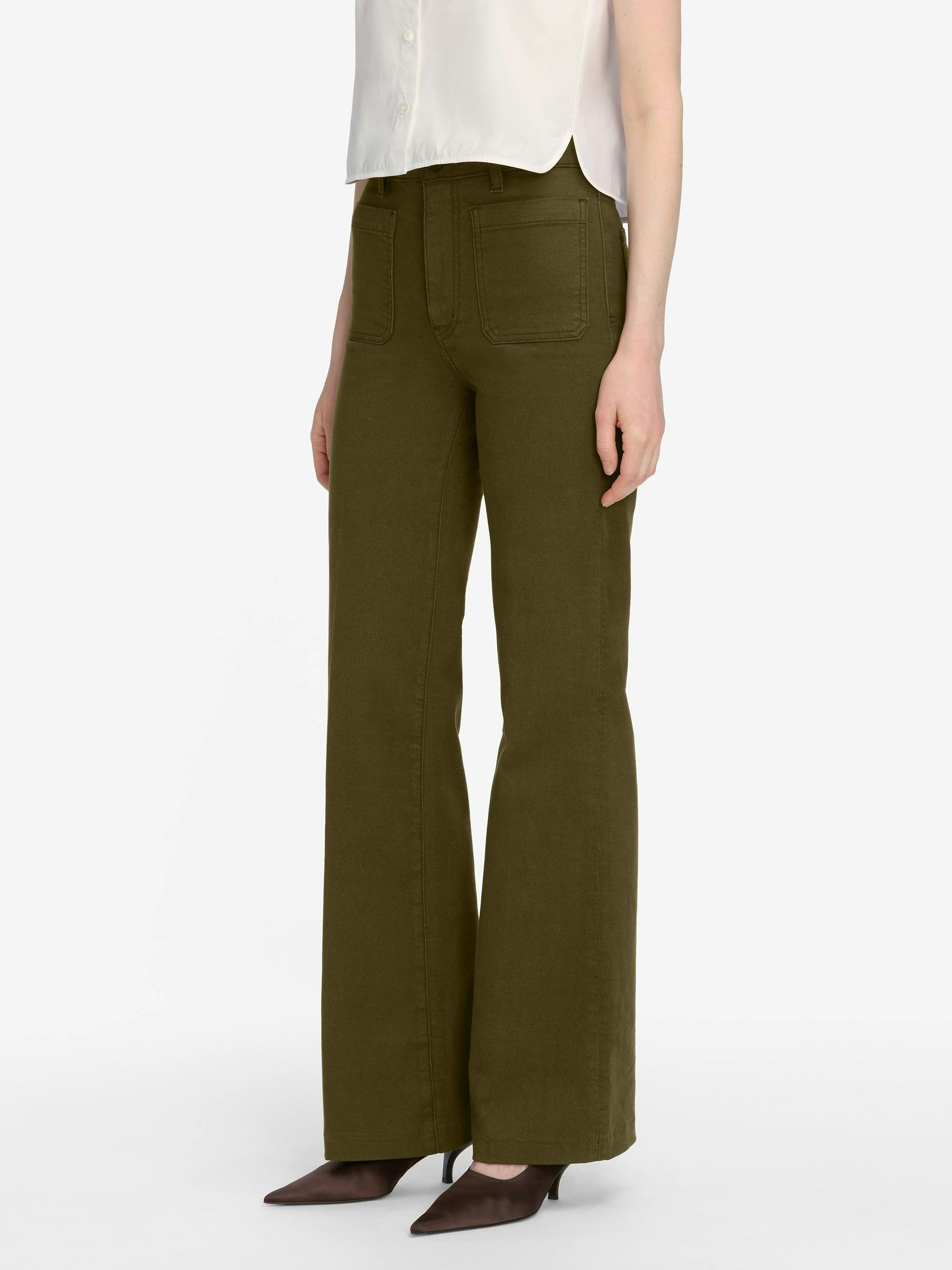 Person wearing olive green pants on a white background