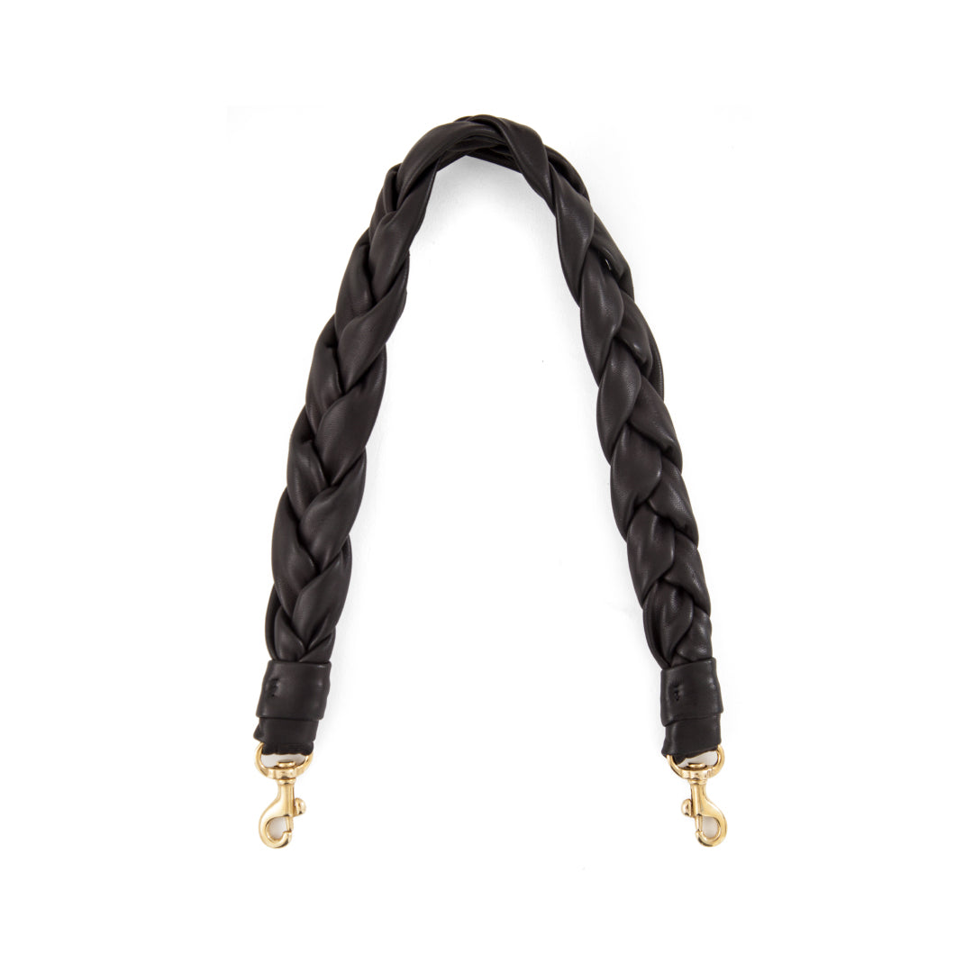 Black braided bag strap with gold hardware on a white background