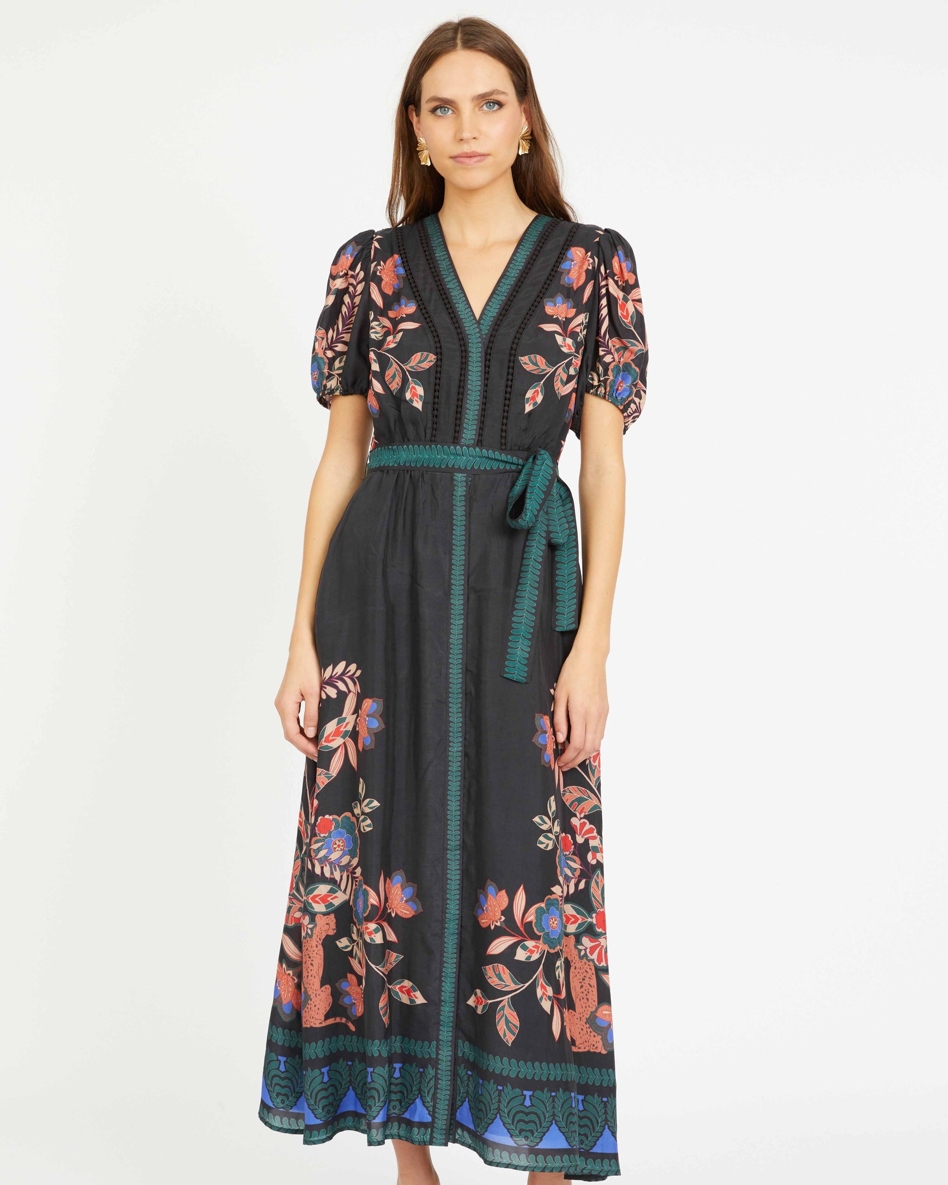Woman wearing a floral dress with a white background