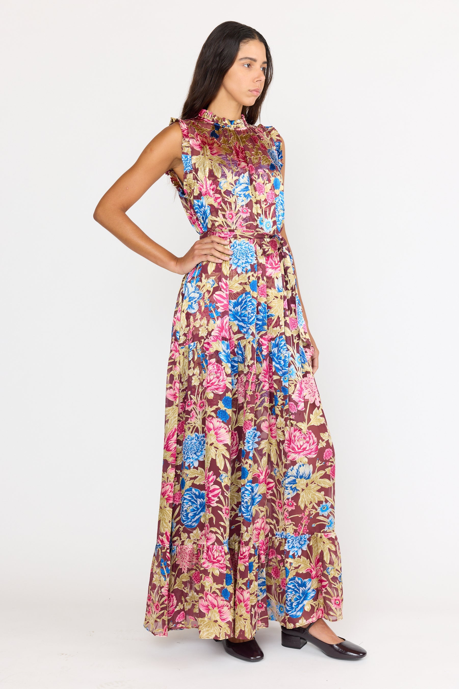 Woman wearing a floral dress on a white background