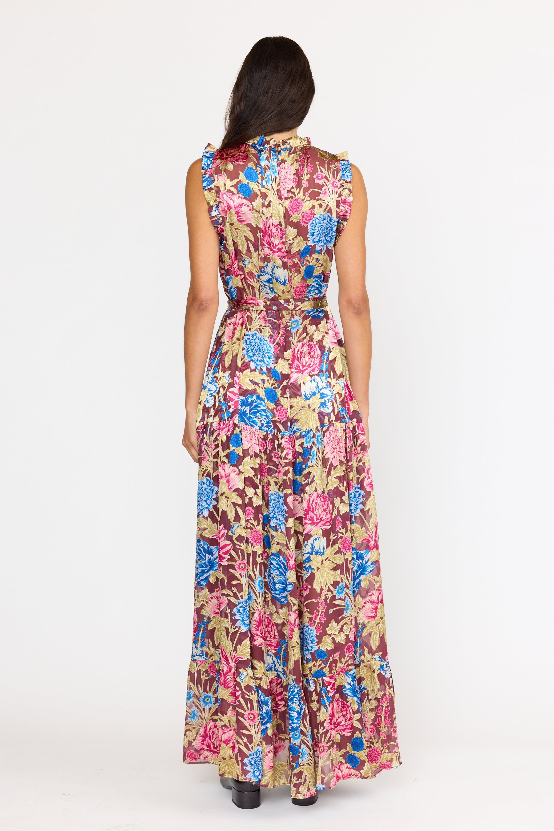 Woman wearing a floral dress on a white background