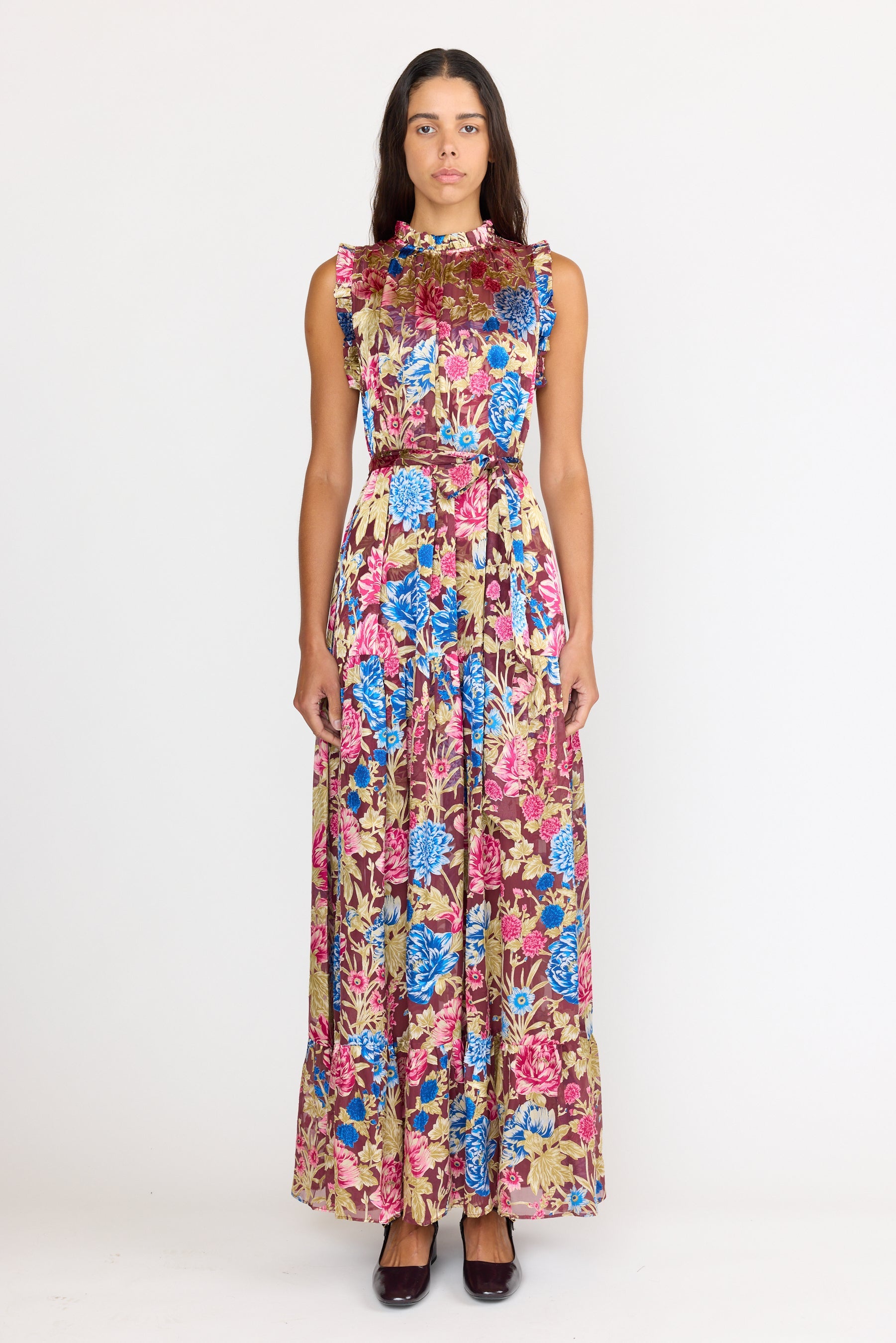 Woman wearing a floral dress on a white background