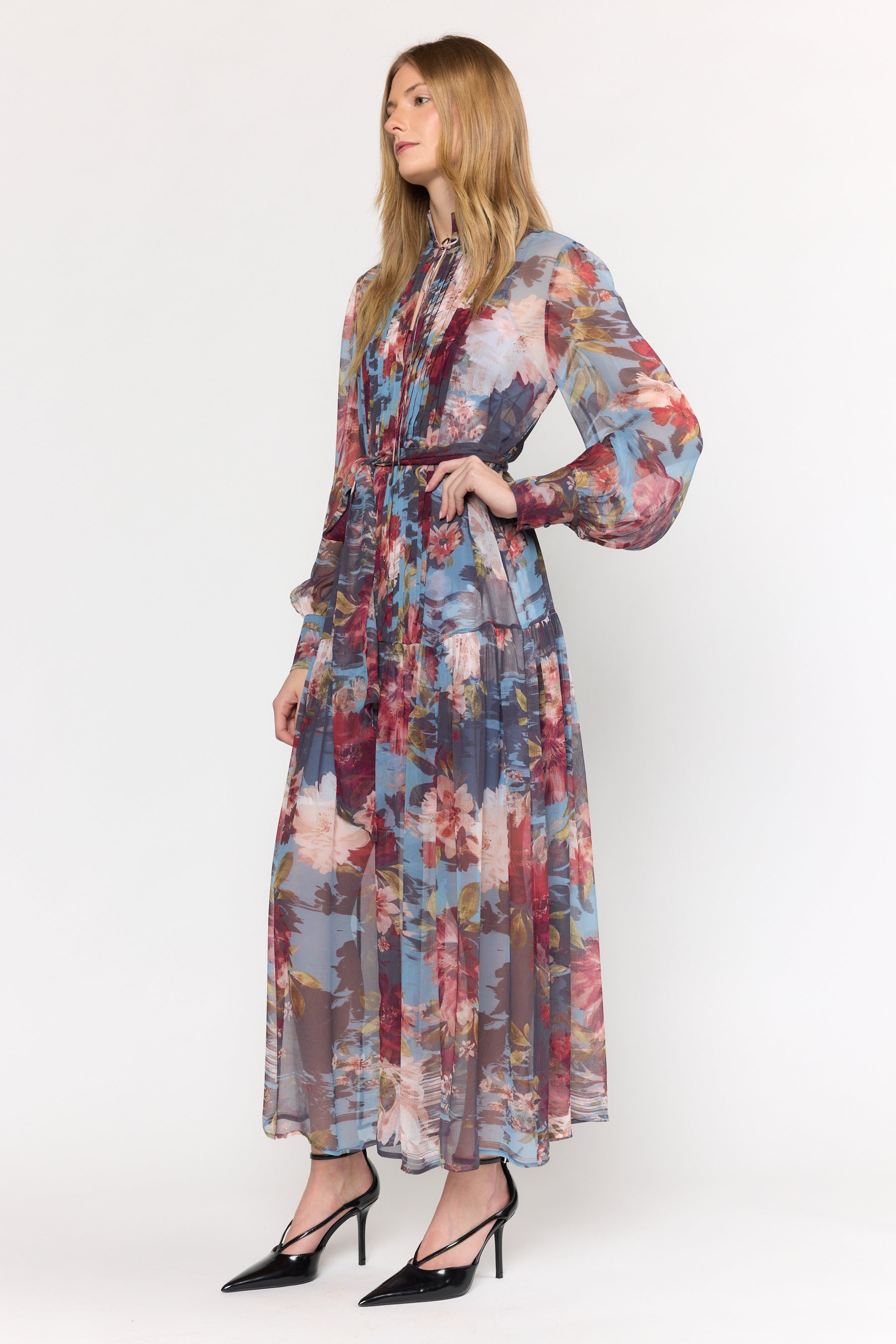 Woman wearing a floral dress on a white background