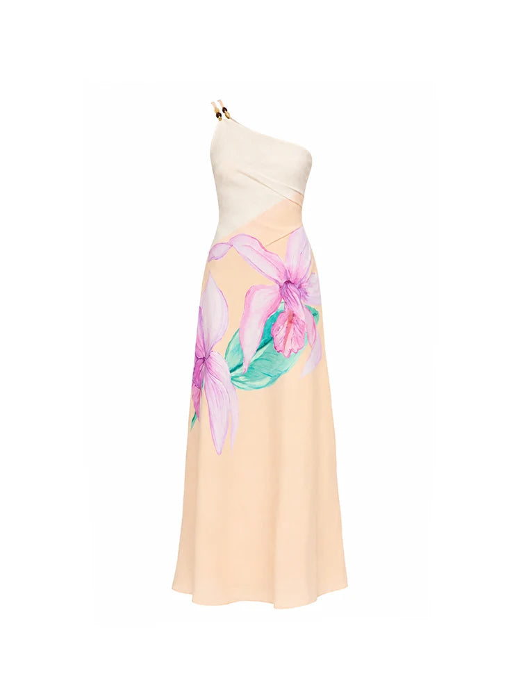 A one-shoulder midi dress with a cream upper bodice and a peach skirt featuring a large pink and green floral print, shown on a white background.