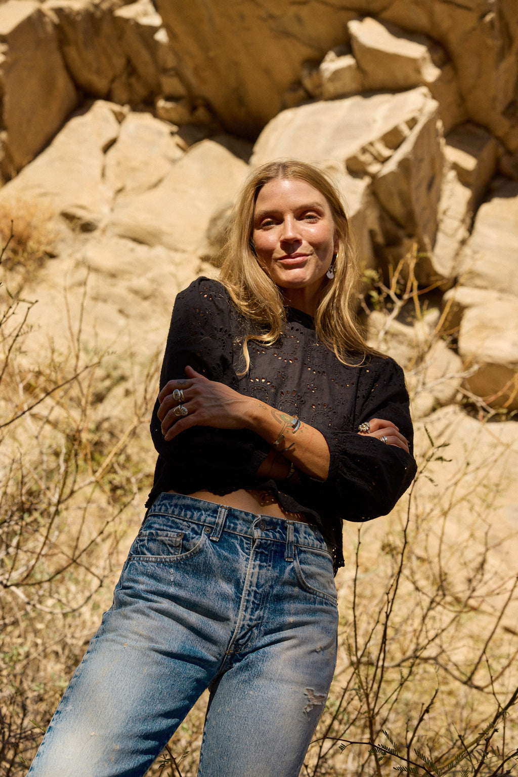 Woman standing in a rocky desert landscape
