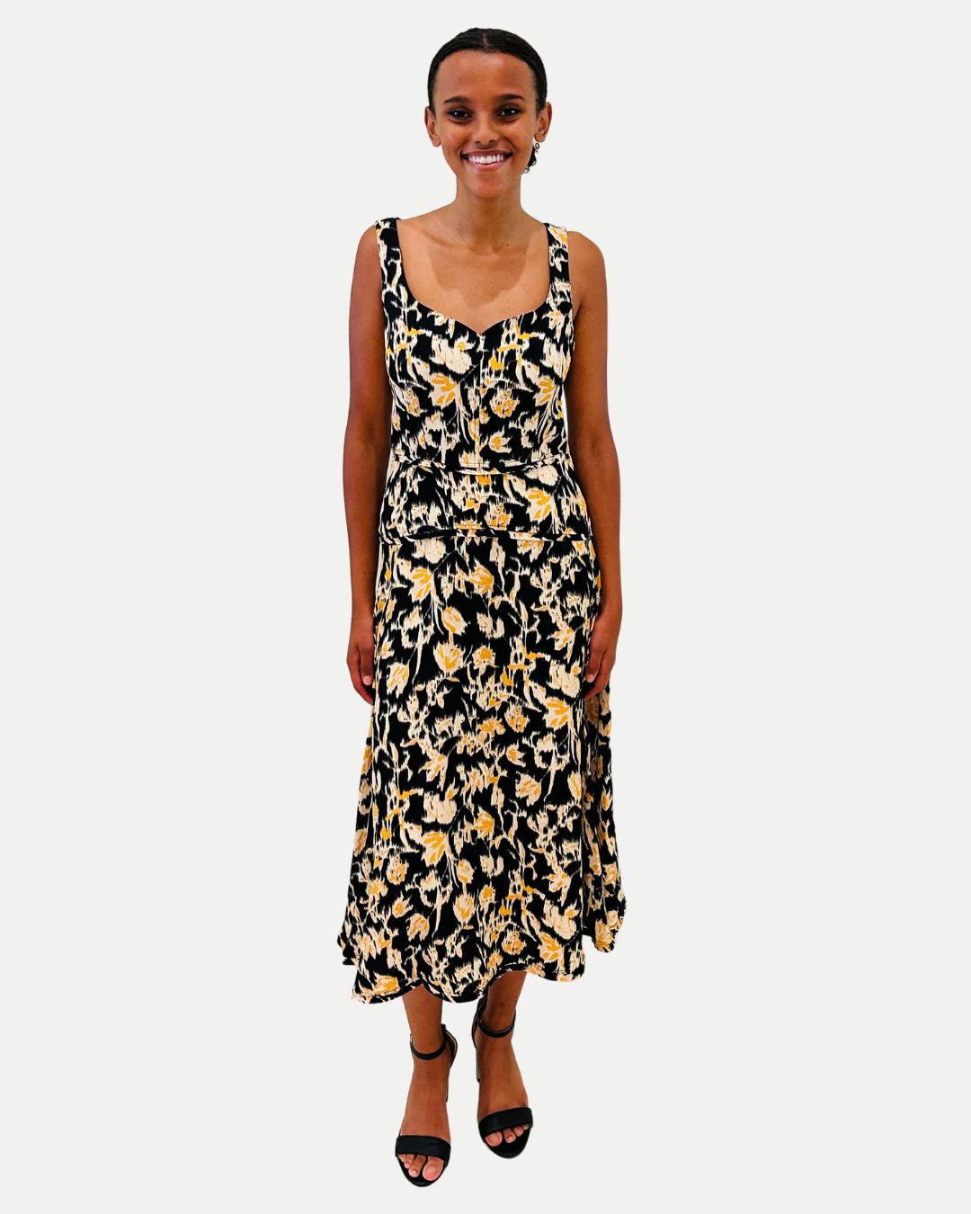 Woman wearing a floral dress on a white background
