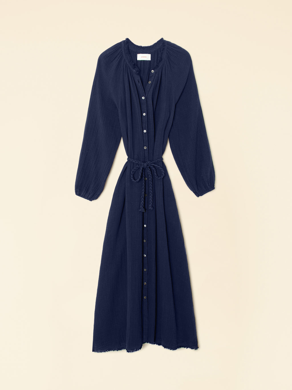 Navy blue dress with long sleeves on a beige background