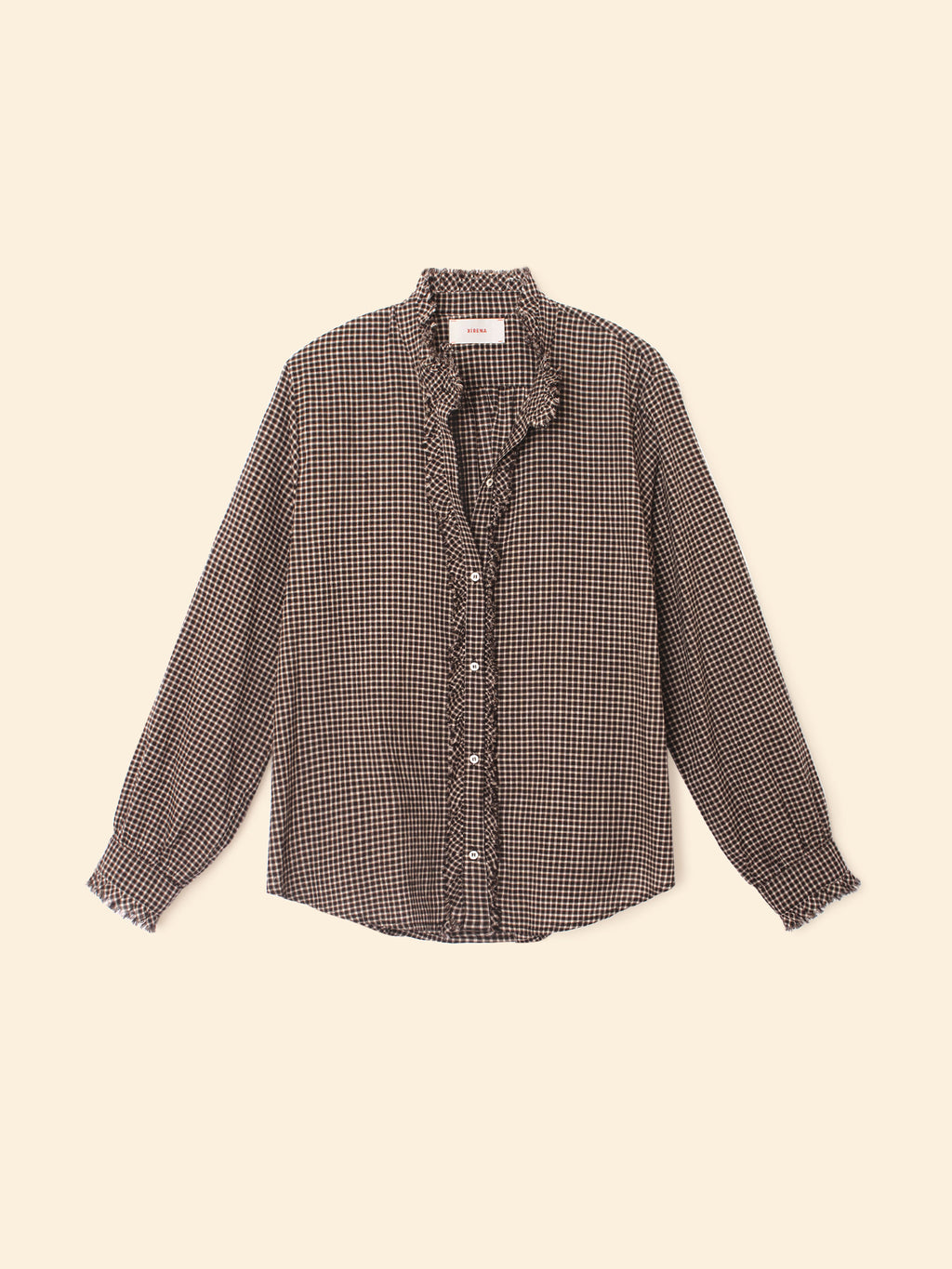 Checkered shirt with ruffled collar on a beige background