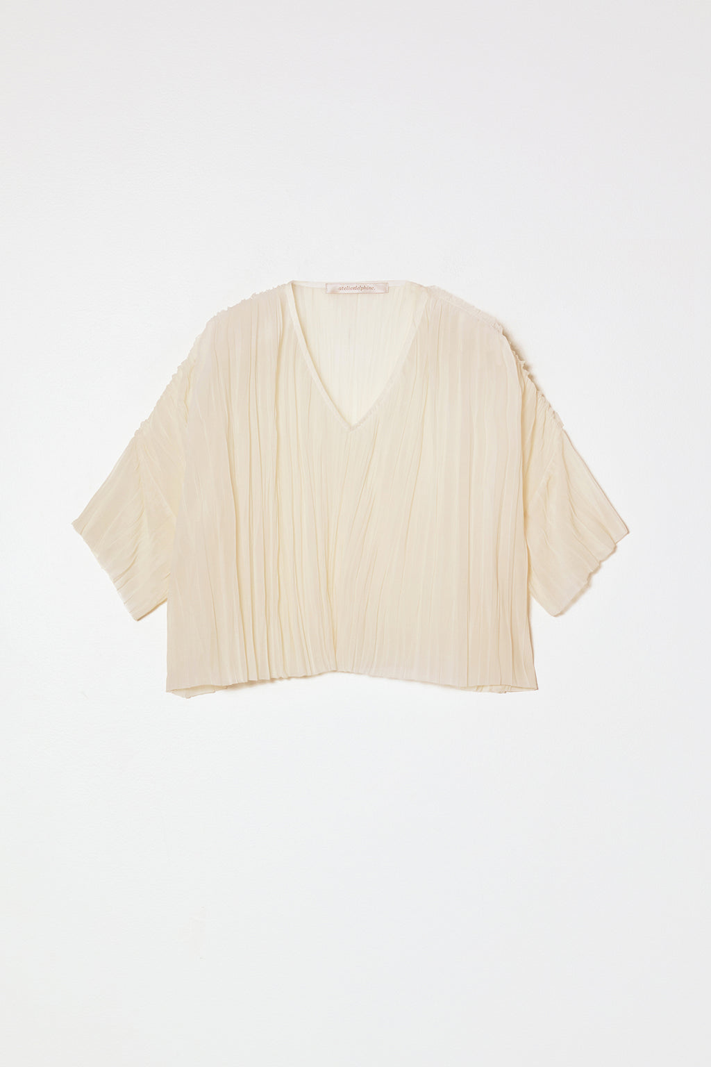 Atelier Delphine | Flared Tee Random Pleats in Cream