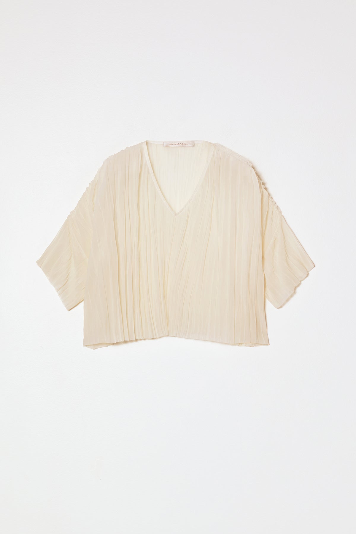 Atelier Delphine | Flared Tee Random Pleats in Cream