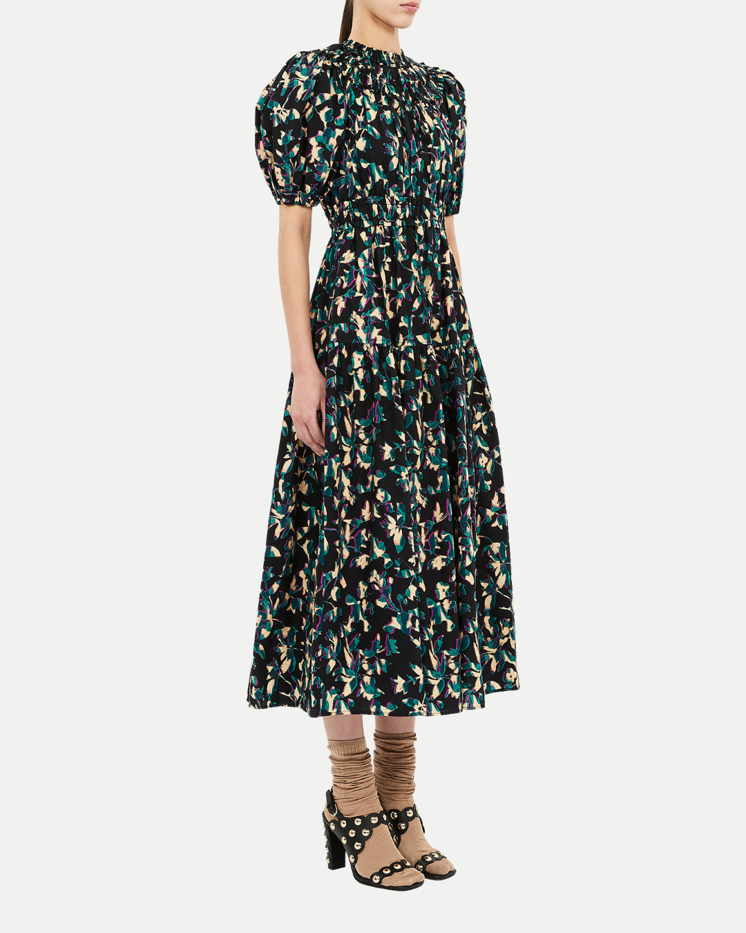 Woman wearing a floral dress on a white background