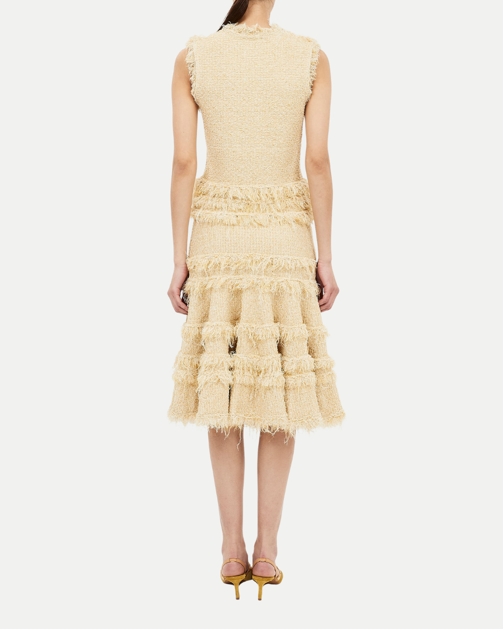 Beige ruffled dress on a white background