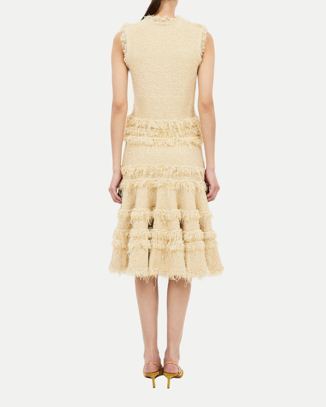 Beige ruffled dress on a white background