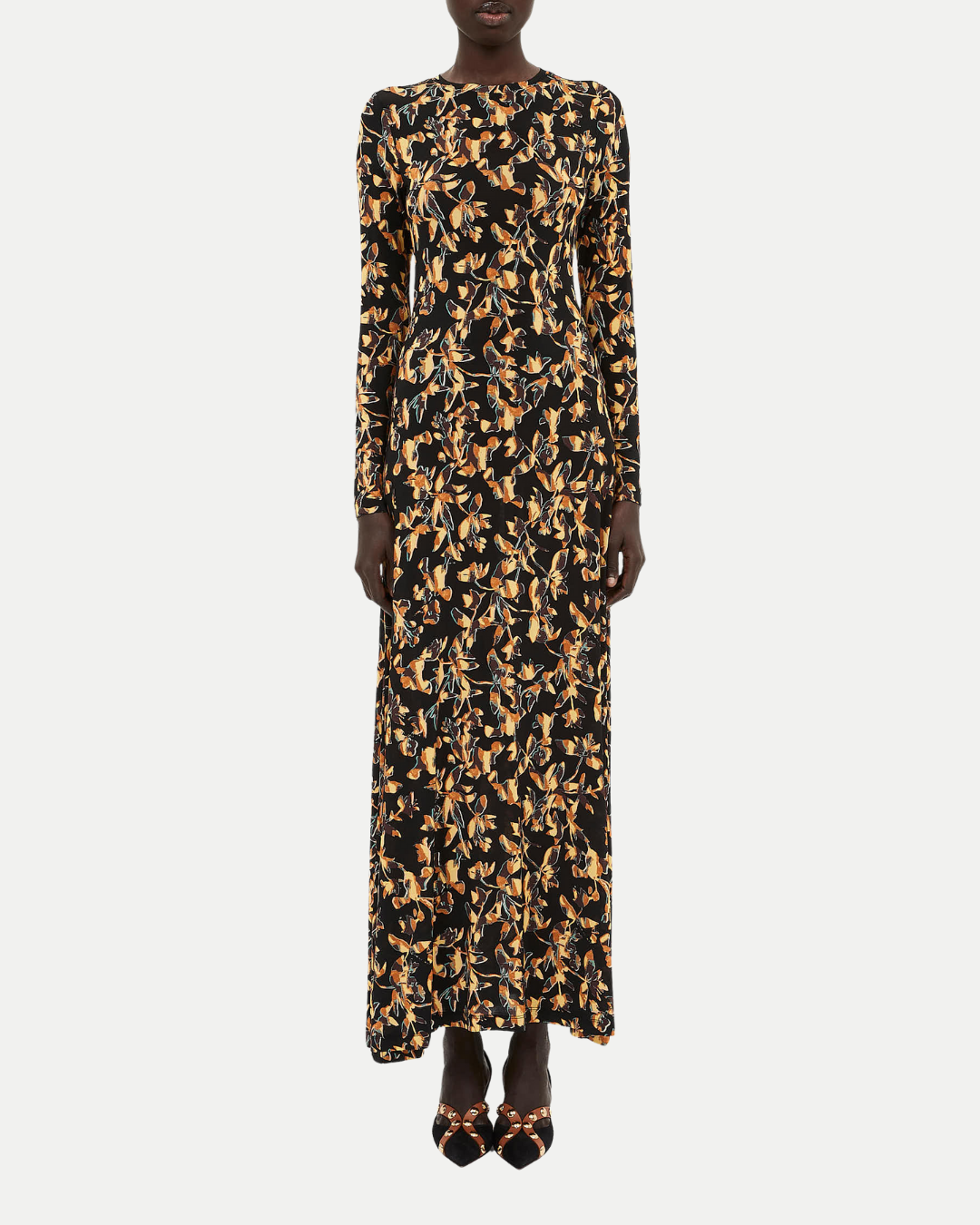 Long-sleeve dress with a black and gold pattern on a white background