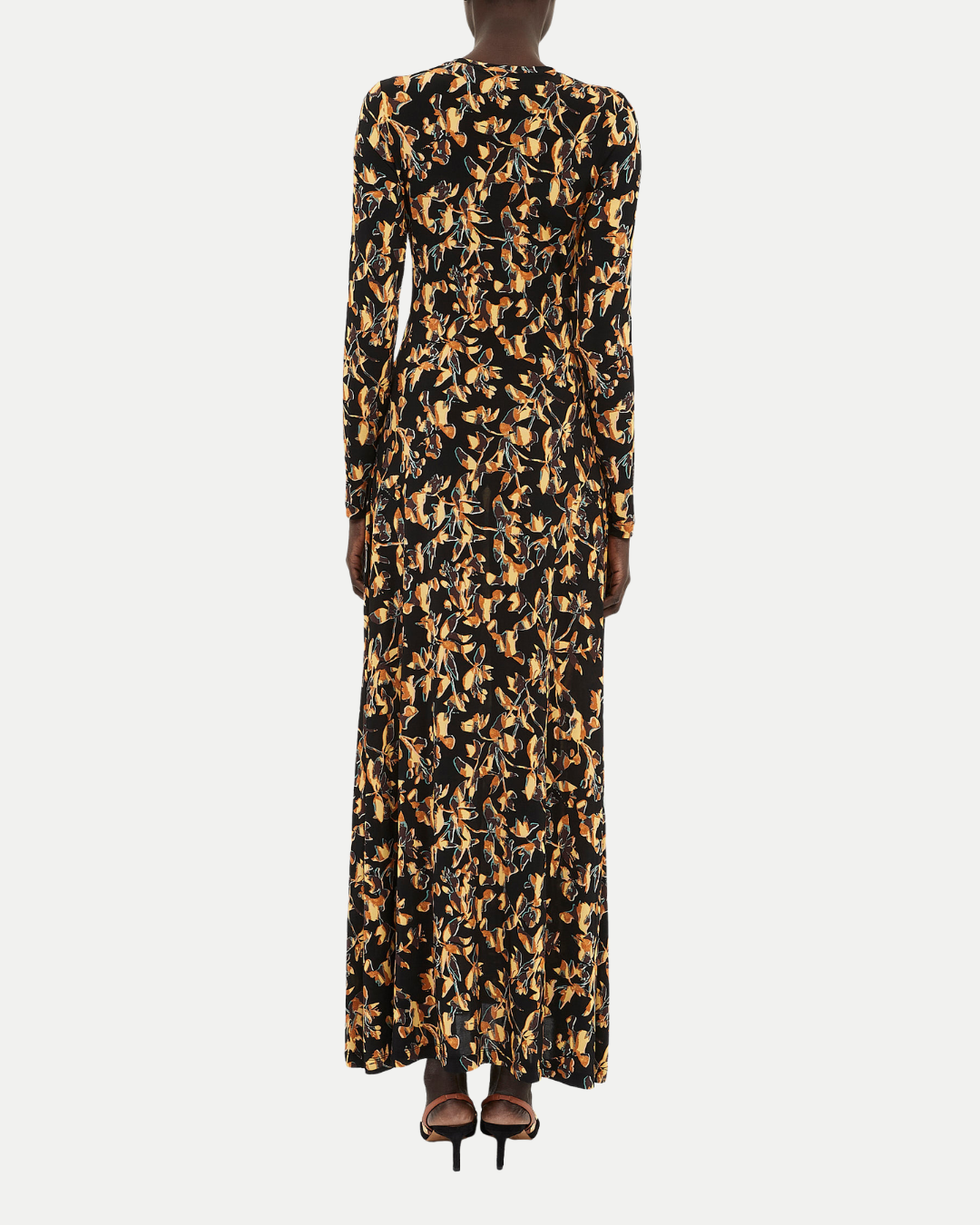 Long dress with a black and gold pattern on a white background